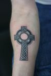 cross celtic tattoo on arm